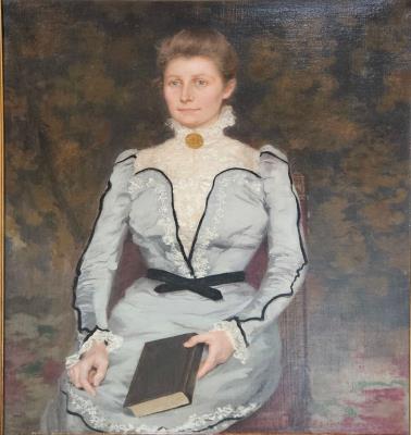 Portrait of a lady in gray satin dress, seated, book in hand