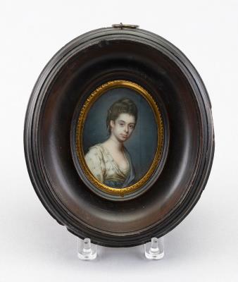 Portrait miniature on ivory of a lady against blue drapery