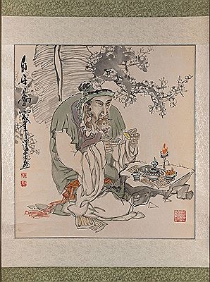 Lohan drinking tea under a prunus tree