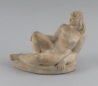Carved stone reclining female nude