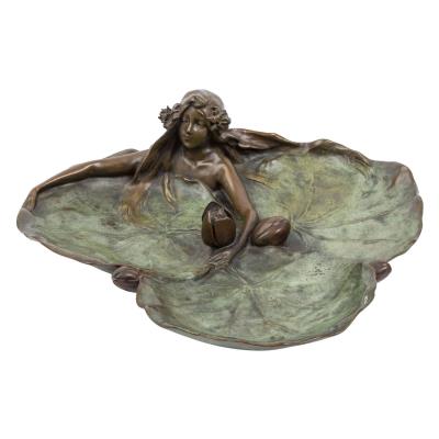 Bowl with nymph in a water lily leaf