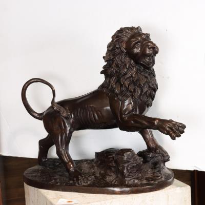 Patinated bronze model of a lion
