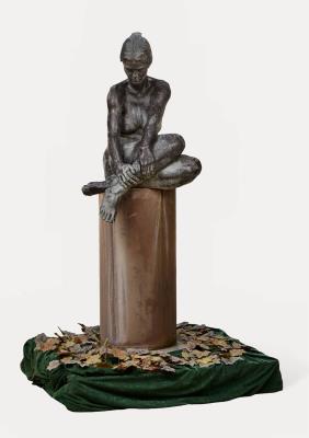 Young seated nude woman