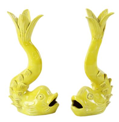 Pair of French dolphin-form candlesticks