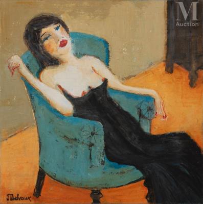Young woman reclining on a green armchair