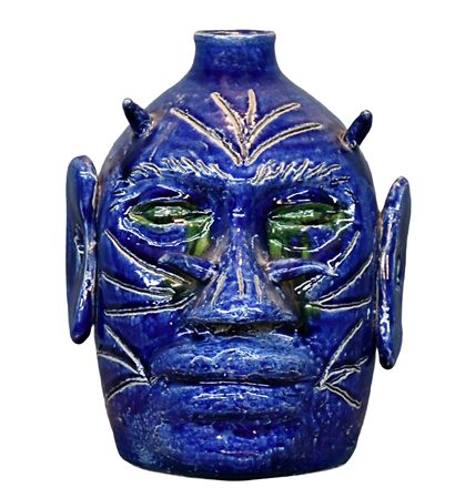 Blue and Green Glaze Devil Face Jug by Edwin Meaders - Auction record, sale price, and art valuation. Compare with similar artists and explore comparable artworks.