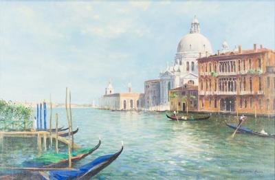 Venice canal with gondolas and a distant view of the Campanile Tower