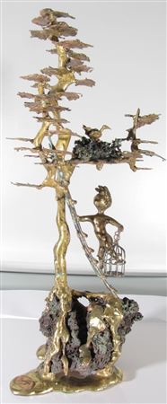 Boy catching bird in tree