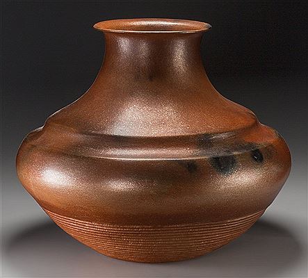A Large Nambe Orange Micaceous Jar by Lonnie Vigil - Auction record, sale price, and art valuation. Compare with similar artists and explore comparable artworks.