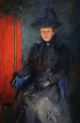 Portrait of an elegant lady in black dress, side green plant against red background