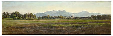 Blick auf Westerndorf bei Rosenheim mit der Kirche "St. Johann Baptist und Heilig Kreuz“. im Hinter- grund der Wendelstein