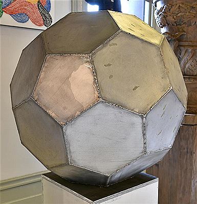 Geometric multi-faced brushed aluminum sculpture