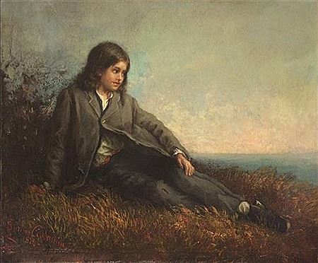 Young boy looking at the sea