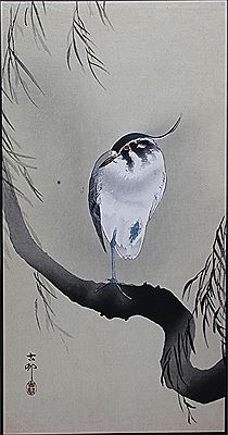 Portrait of an egret on a branch