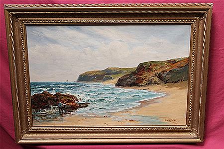 Coastal shore with a fisherman drawing up his boat near St. Davids