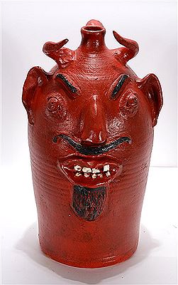 Large Red Devil With Curly Horns