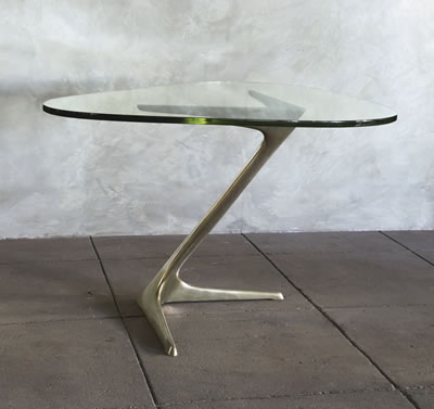 A RARE "UNICORN" TABLE-DESK, MODEL NO. 7050 by Vladimir Kagan - Auction record, sale price, and art valuation. Compare with similar artists and explore comparable artworks.