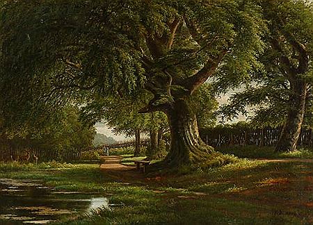 Park scenery with a couple walking along a sunlit path