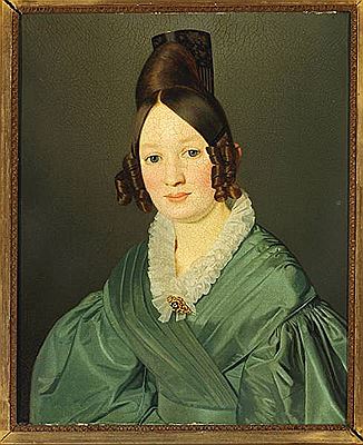 Portrait of a young woman in a green silk dress.