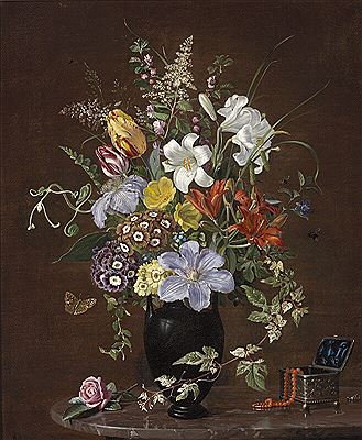 Still life with clematis, tulips, primula and lilies in a black vase, and a jewelry box with a coral chain and a silver ring on a marble table