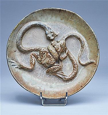 ASSIETTE ronde en grès émaillé brun à décor en bas-relief d'un serpent dévorant une grenouille by Alfred-Jean Halou - Auction record, sale price, and art valuation. Compare with similar artists and explore comparable artworks.
