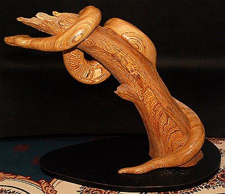 Python Coiled around tree Sculpture laminated Latvian birch Ebonised ovoid plinth