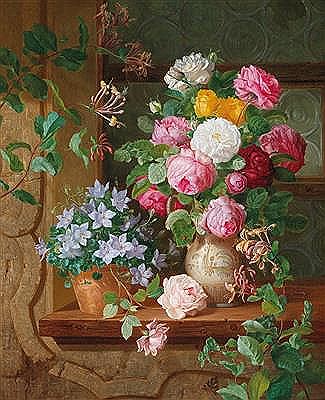 Roses and a blue starflower on a windowsill