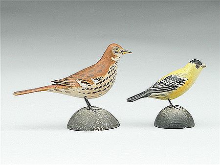 Two miniature songbirds