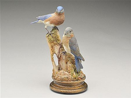 Full size carving of two bluebirds