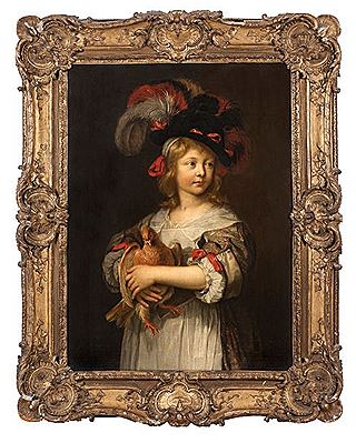 Portrait d'un enfant tenant une poule