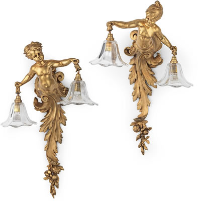 A pair of French late 19th/ early 20th century gilt bronze wall lights