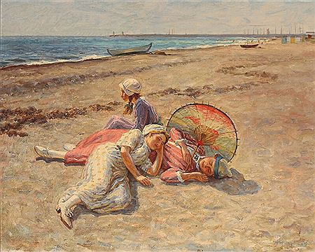 Three young women resting on the beach.