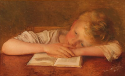 A young boy taking a break from studying.