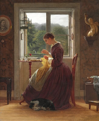 An interior with a young woman sitting in front of the window sewing