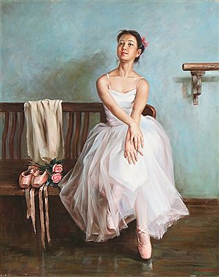 A balletdancer posing on a bench.