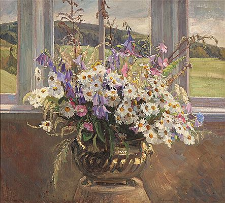A bouquet of flowers in a windowsill.