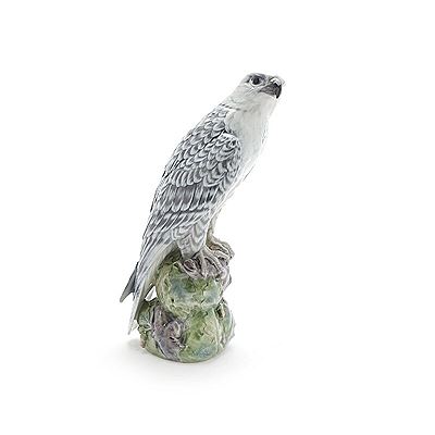 A falcon porcelain figure decorated in underglaze colours.