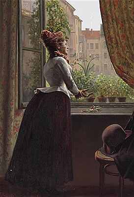 Young elegantly dressed woman looking out of the window