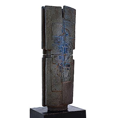 An enamelled and carved section of volcanic rock