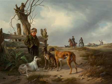 Young boy resting beside a fence with hunting dogs