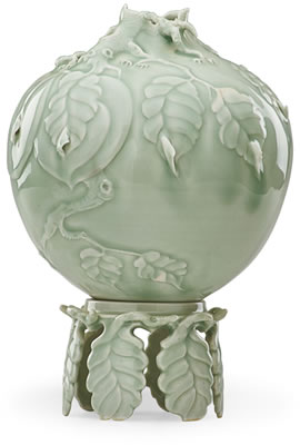 Fine carved celadon vase with peaches on branch on stand, Stevens, PA, 1992