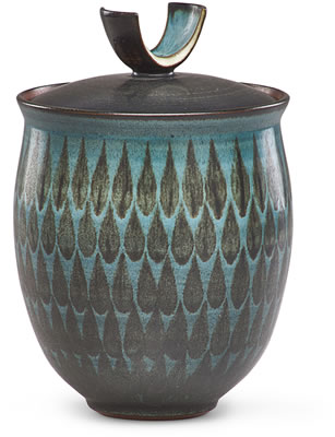 Covered jar with teardrop pattern and curved finial