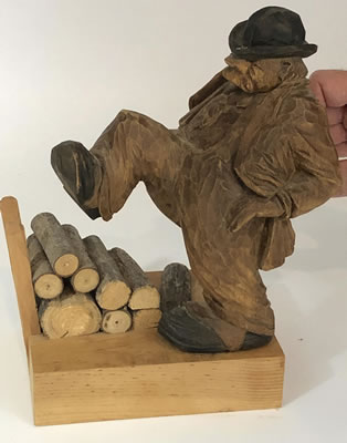 Man in wood pile