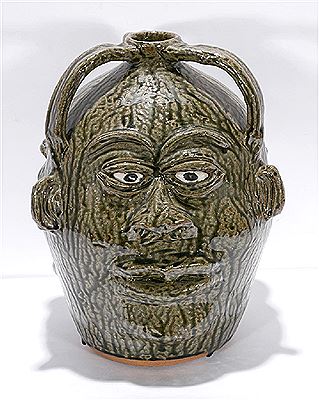 Large Three Face Jug.