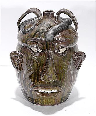 Large Face Jug With Snake. by Wayne Hewell - Auction record, sale price, and art valuation. Compare with similar artists and explore comparable artworks.