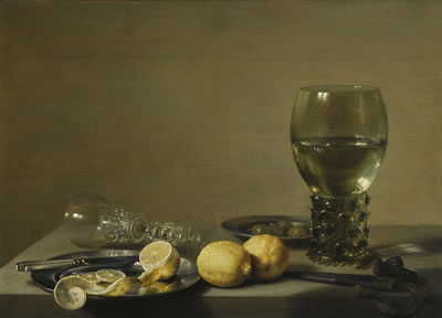 STILL LIFE OF LEMONS AND OLIVES, PEWTER PLATES, A ROEMER AND A FAÇON-DE-VENISE WINE GLASS ON A LEDGE