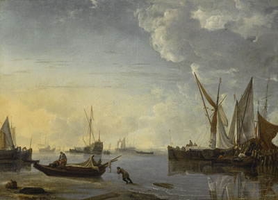 SHIPPING SCENE IN A CALM AT SUNSET, WITH FIGURES ON THE SHORE IN THE FOREGROUND