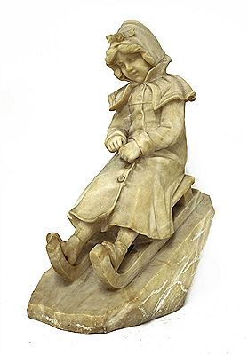 An alabaster sculpture of a girl seated on a toboggan