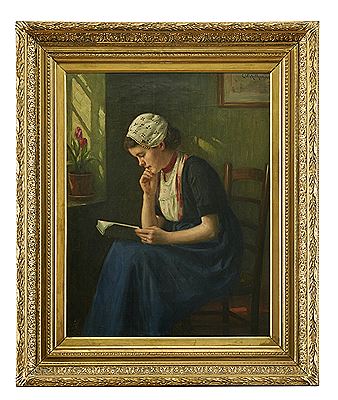 Reading young woman by window