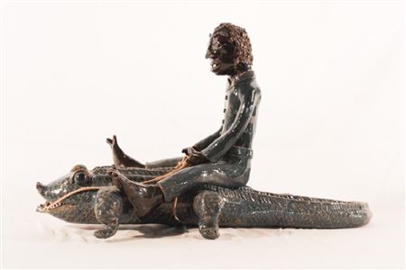African American man riding an alligator